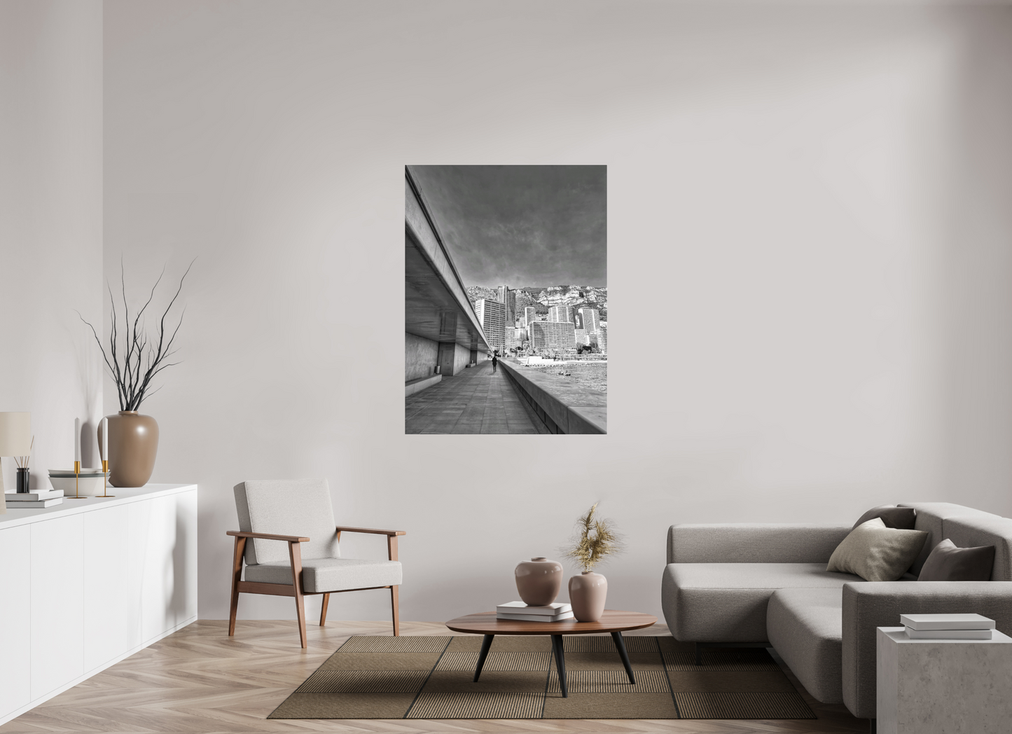Framed black-and-white city street photo print on wall near sofa