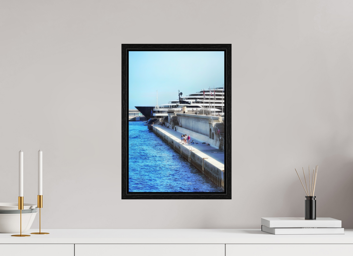 Framed harbor print under acrylic glass, blue canal beside cruise ship, black border frame.
