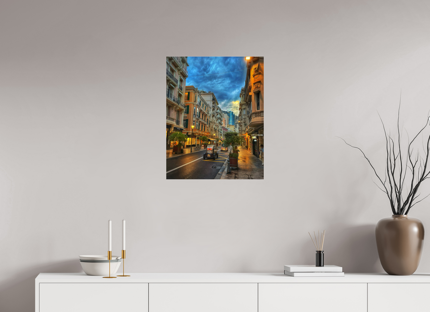 Wall-mounted city street photo in acrylic glass floater frame, warm storefront lights