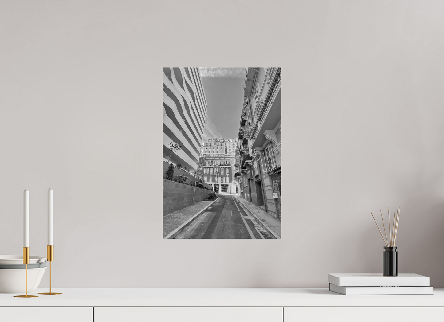 Framed black-and-white city street photo print with a centered road and tall architecture