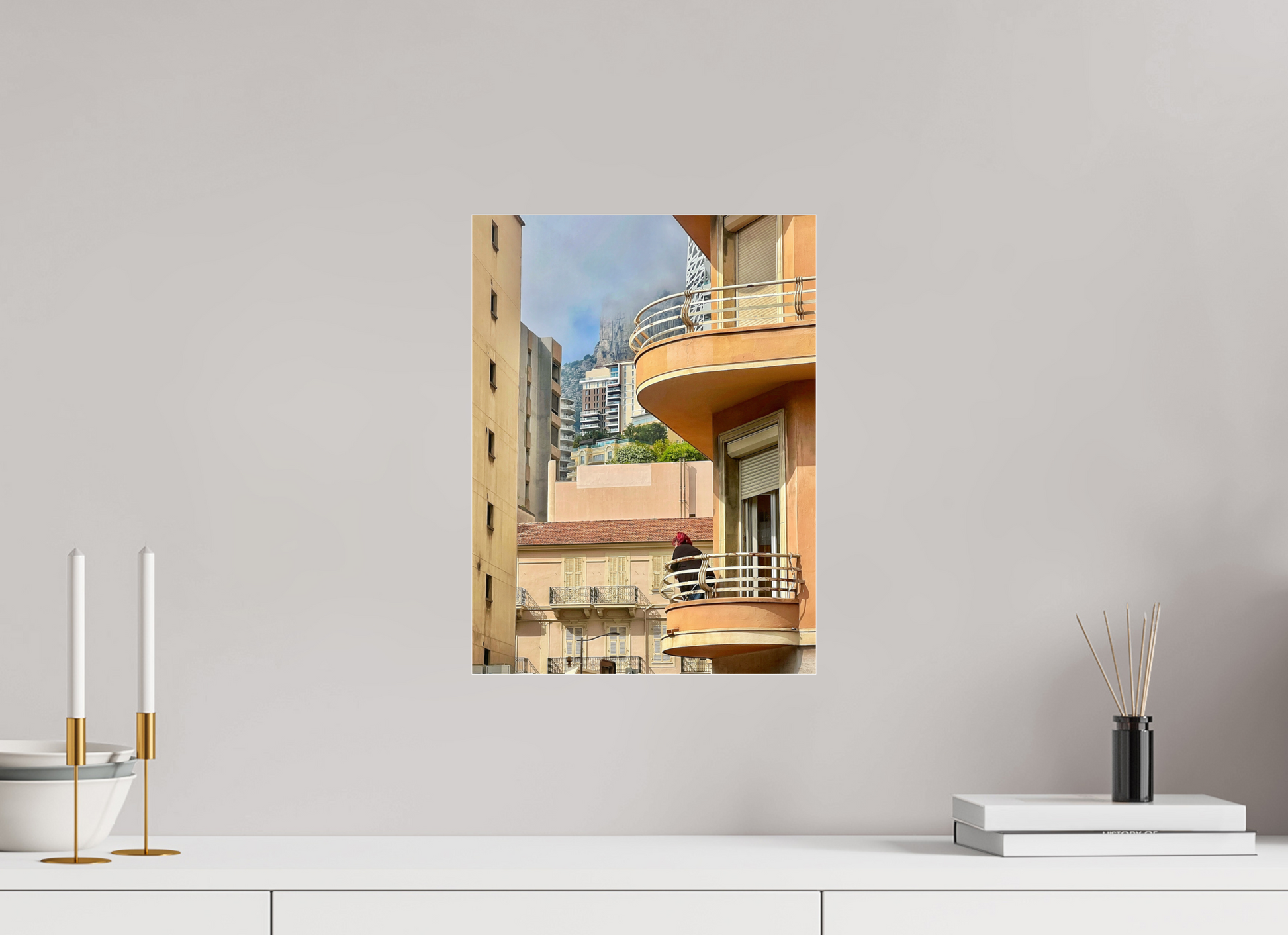 Framed balcony photo print with wooden frame on light wall in wide view