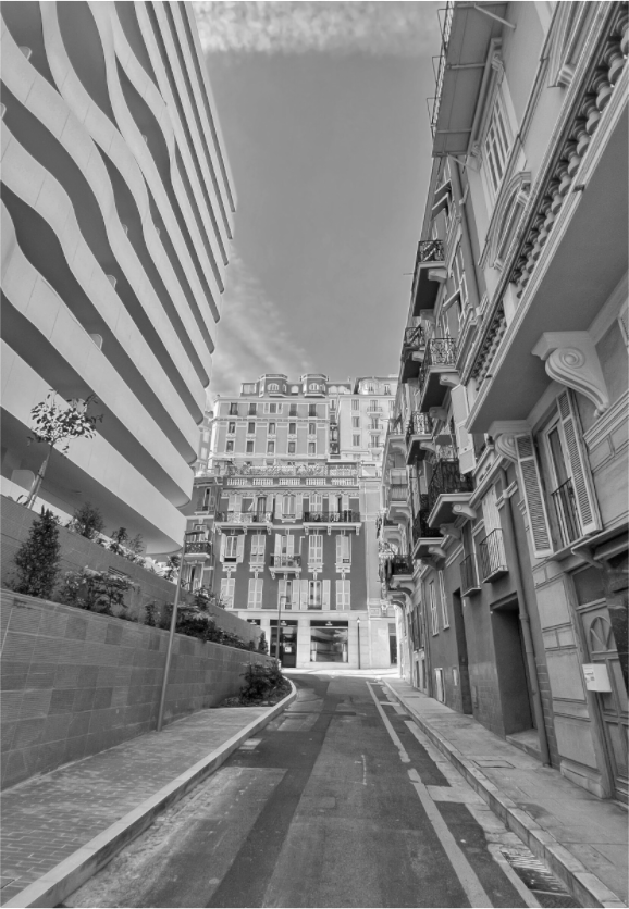 Close-up view of a black-and-white city street photo print with building details