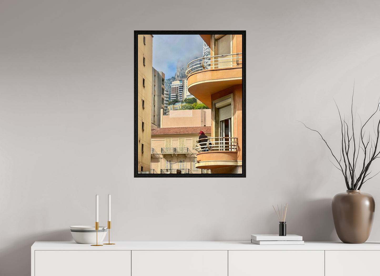Black floater frame wall art with acrylic-glass city photo, warm-toned balconies and windows