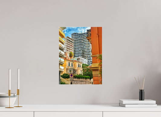 Floater-framed city photo print on wall with high-rise tower and colorful streetscape