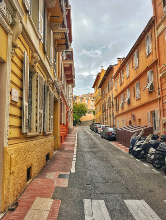 Square street photo print showing a European alley between tall buildings