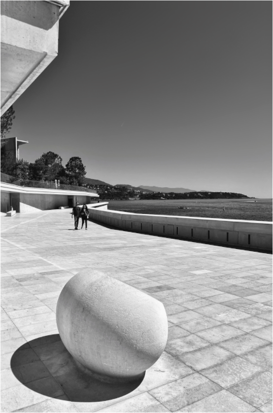 Framed acrylic photo print close-up of black-and-white stone in tiled plaza