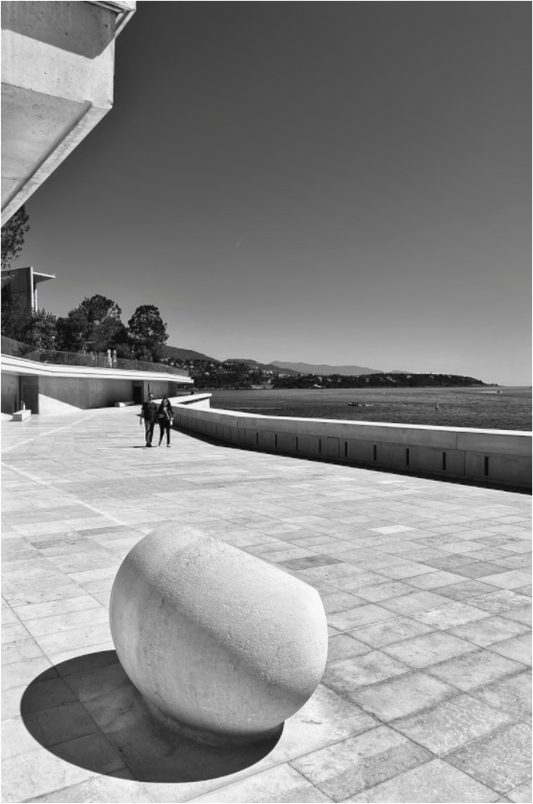 Framed acrylic photo print close-up of black-and-white stone in tiled plaza