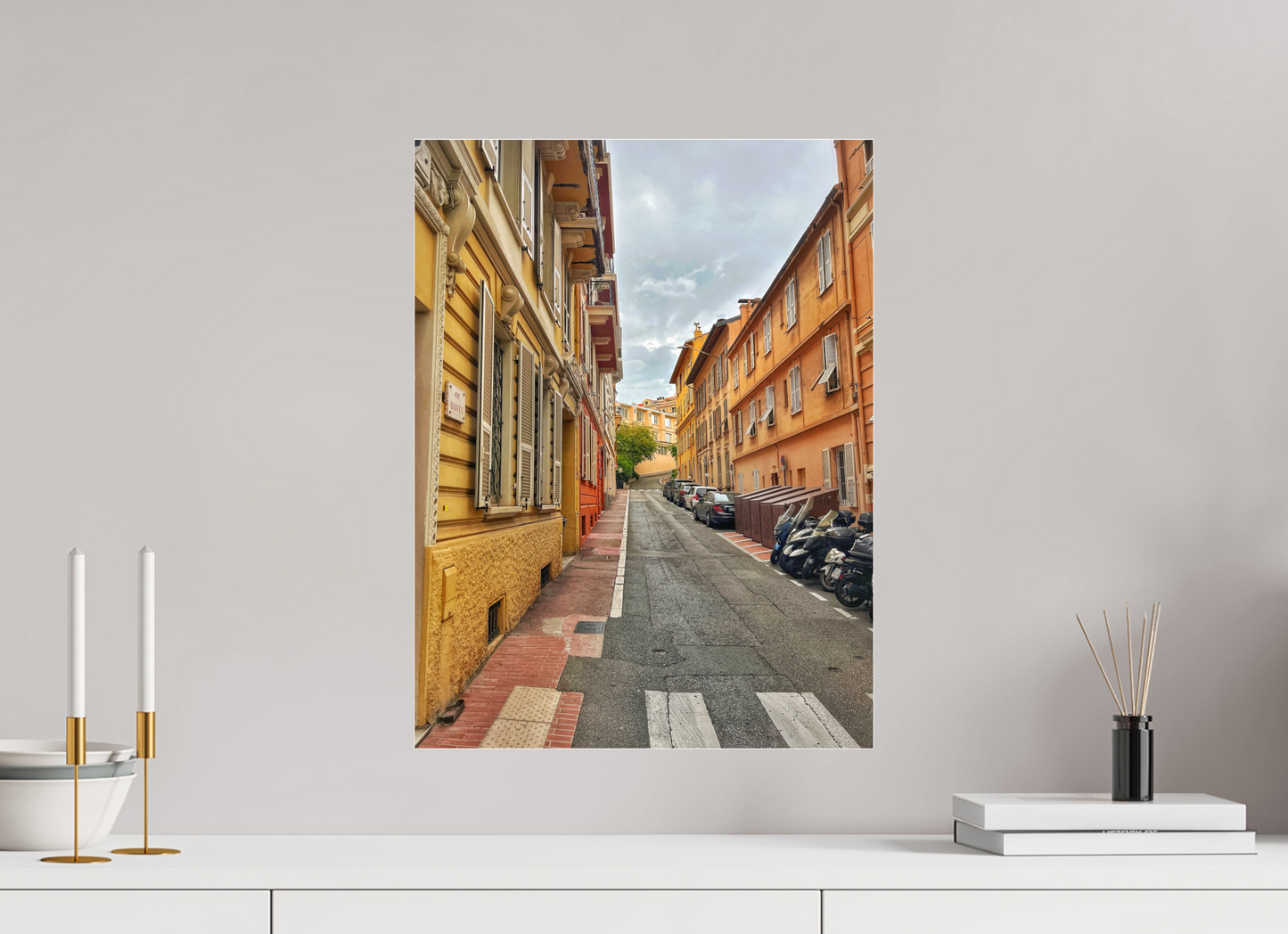 Square street photo print with brick buildings lining a narrow sidewalk and street