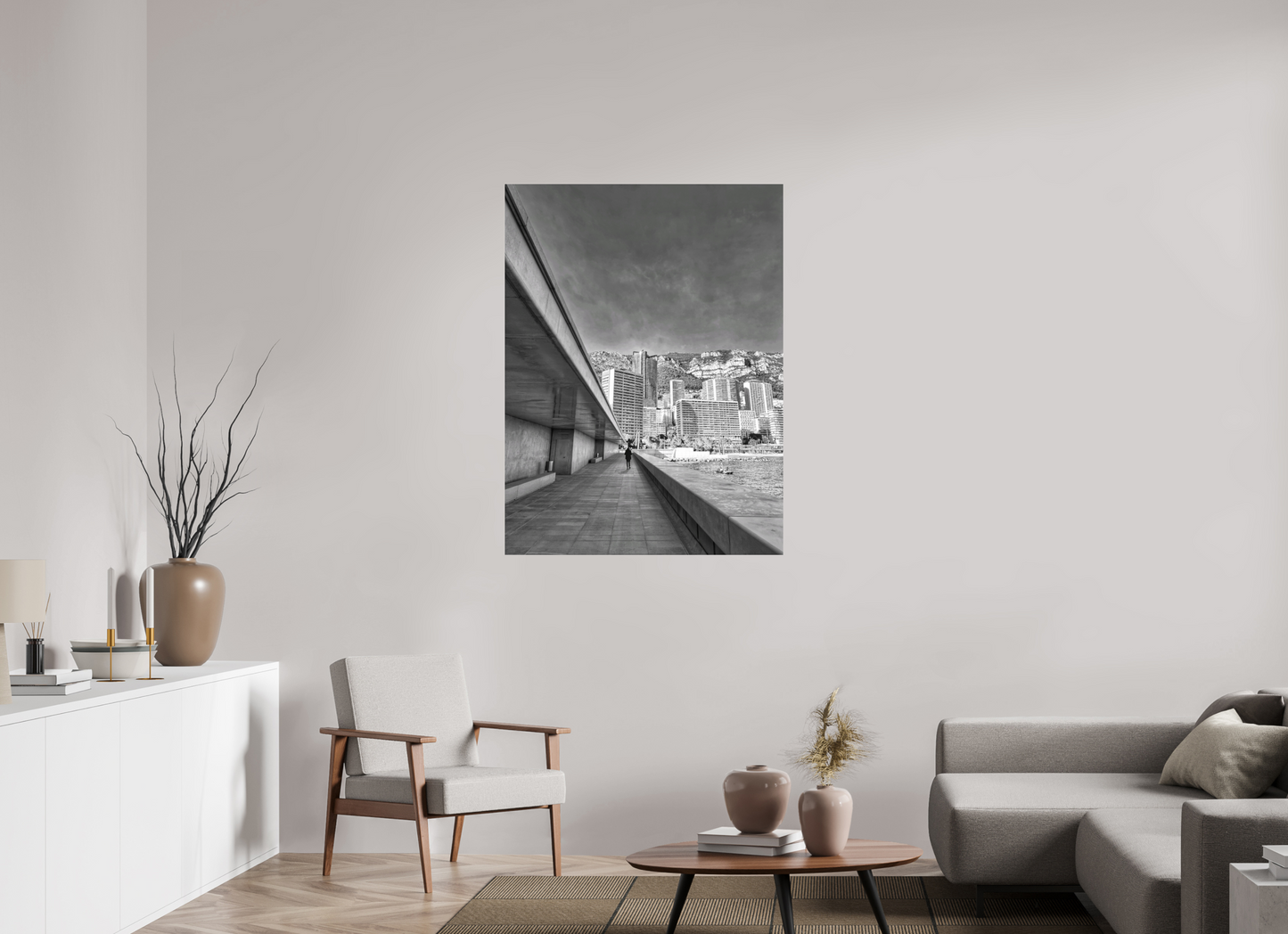 Framed black-and-white city street photo print on wall above coffee table