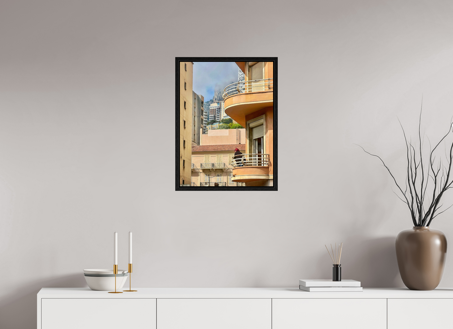 Acrylic-glass cityscape photo in black floater frame, featuring tall buildings and balconies